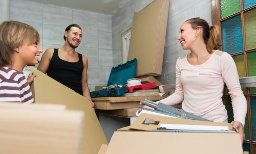 Removal team planning a home move in Kentish Town with boxes and furniture