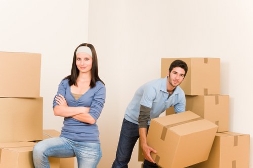 Local moving team handling furniture in a Kentish Town property