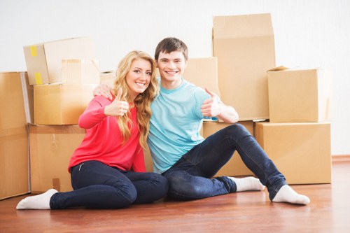 Student move items prepared for transport and storage